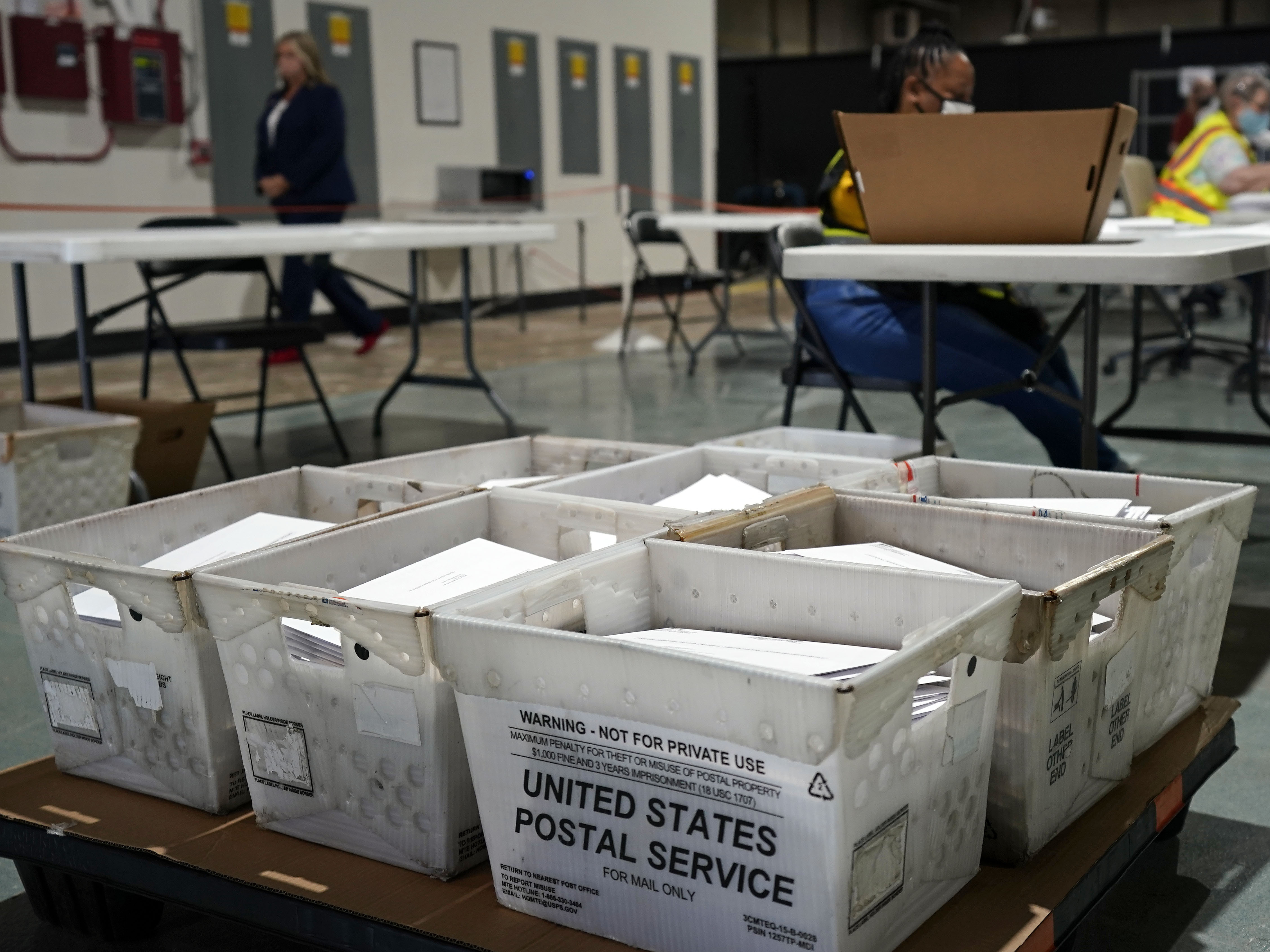 caption: Workers prepare absentee ballots for mailing at the Wake County Board of Elections in Raleigh, N.C., Thursday, Sept. 3, 2020. Other states will soon follow North Carolina in sending out ballots to voters as a nearly two month-long general election voting season gets underway.