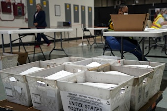 caption: Workers prepare absentee ballots for mailing at the Wake County Board of Elections in Raleigh, N.C., Thursday, Sept. 3, 2020. Other states will soon follow North Carolina in sending out ballots to voters as a nearly two month-long general election voting season gets underway.