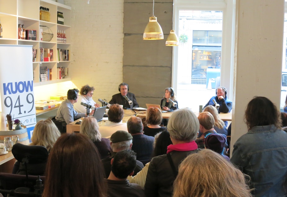 caption: The 'Week in Review' panel broadcasts in front of a live audience at Little London Plane in Pioneer Square on Friday, Jan. 9, 2015.