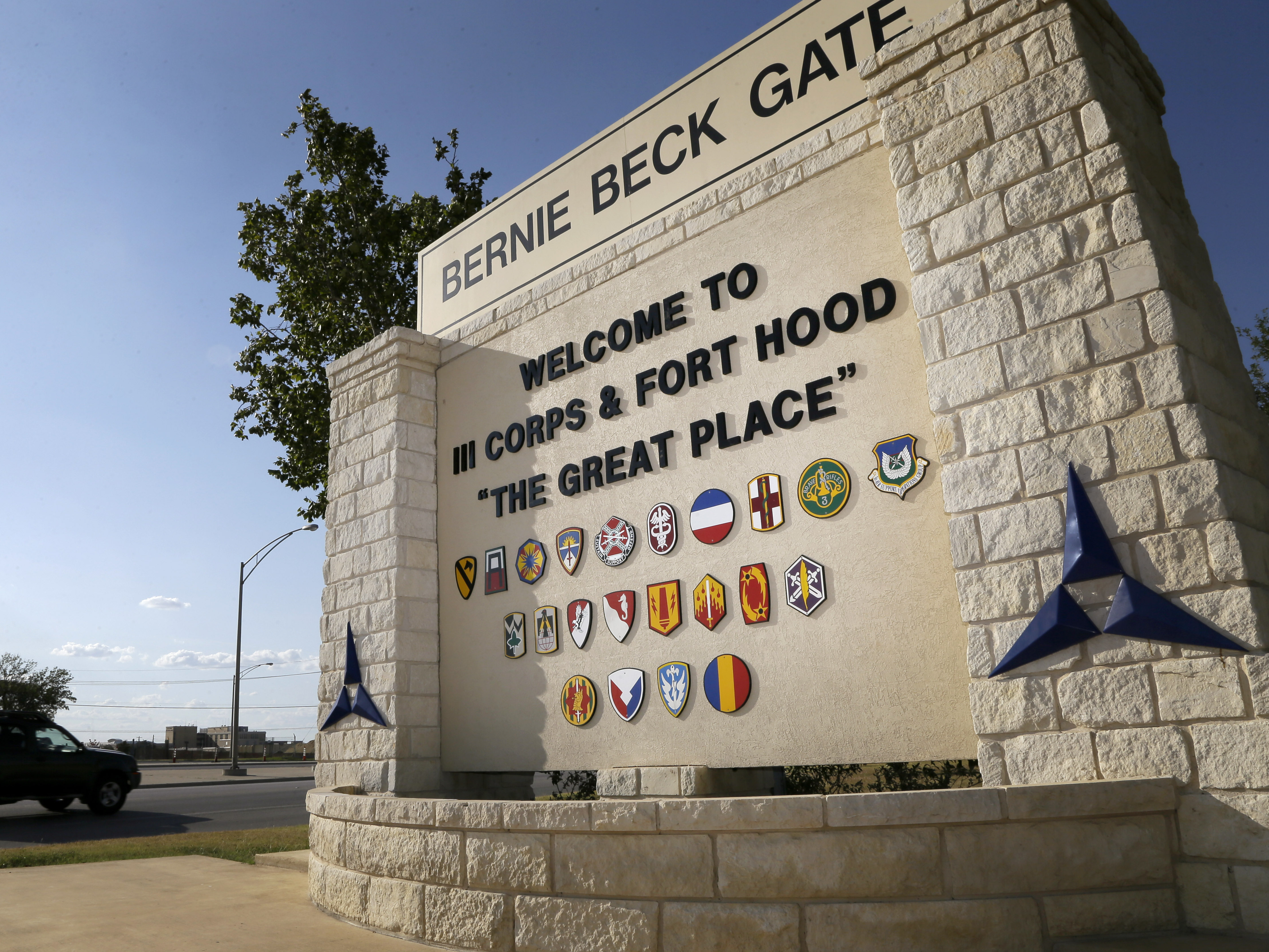 caption: Traffic flows past a welcome sign at Fort Hood, which is being renamed in honor of Richard Edward Cavazos, the Army's first Hispanic four-star general.