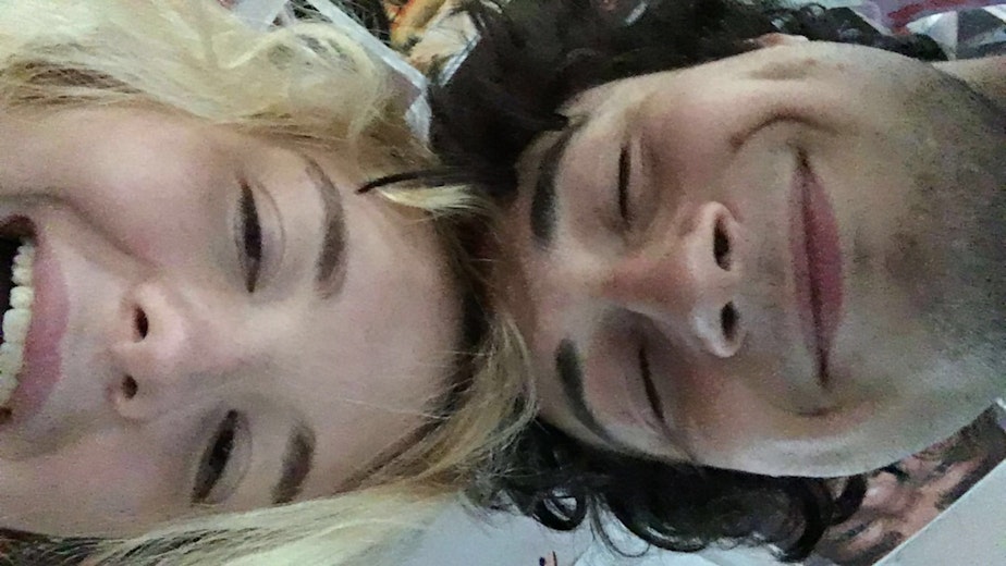 caption: Garfield High School senior Maia Demar with her boyfriend Max Devine.