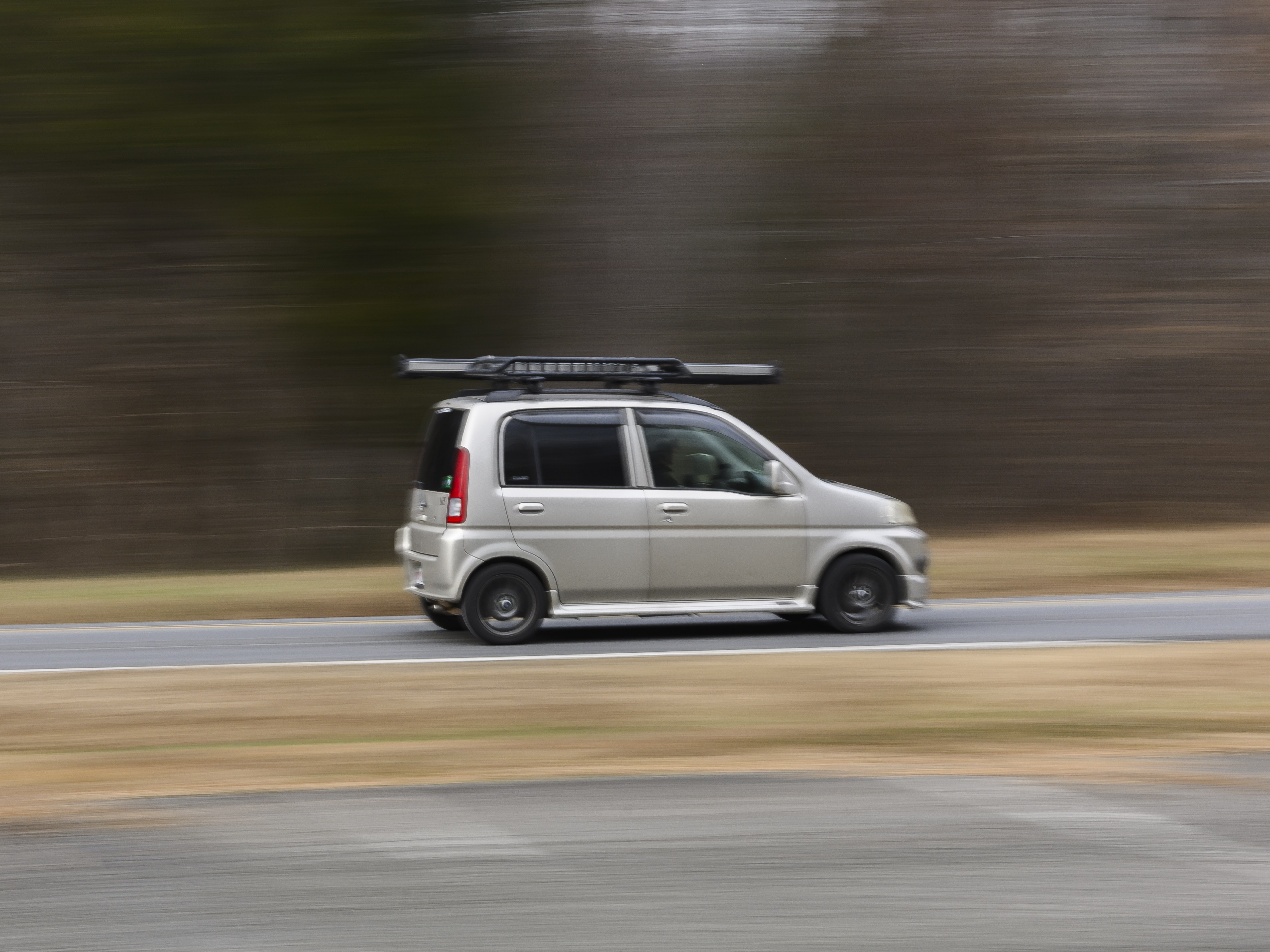 caption: A driver takes a Honda Life on a ride during a meeting of the Capital Kei Car Club in Clifton, Virginia. Kei cars are ultracompact Japanese vehicles defined by strict size and engine limits.