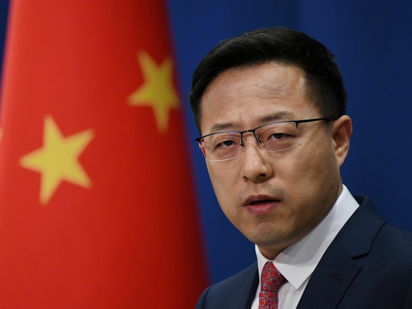caption: Chinese foreign ministry spokesperson Zhao Lijian speaks at the daily media briefing in Beijing on April 8, 2020. This week, Zhao was assigned a new job: deputy director of the ministry's Department of Boundary and Ocean Affairs — a lateral move to an obscure post that takes Zhao out of the spotlight.