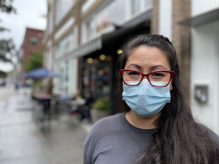 caption: Miki Sodos outside Cafe Pettirosso in Seattle's Capitol Hill neighborhood