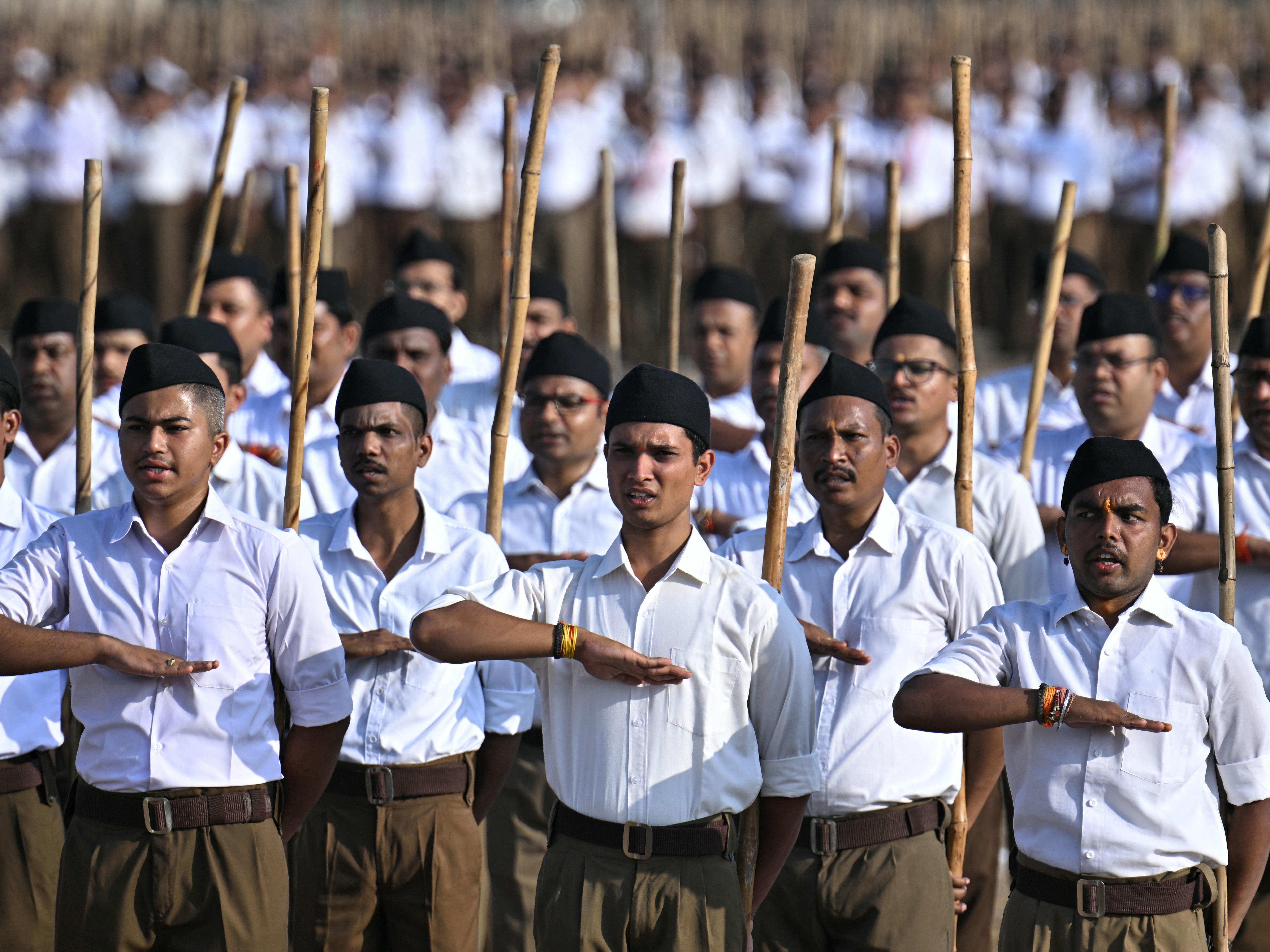 caption: Rashtriya Swayamsevak Sangh (RSS) volunteers take part in the Hindu nationalist organisation's centenary celebrations at Reshimbagh Ground in Nagpur on October 2, 2025.