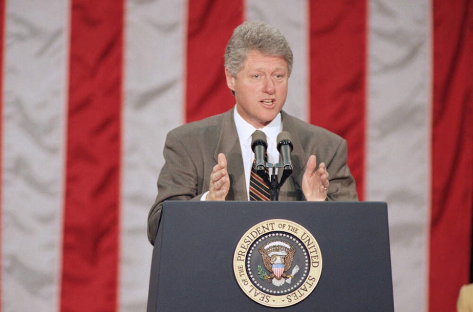 caption: Former President Bill Clinton speaks to law enforcement officials at the Justice Department in Washington, April 11, 1994. The president urged Congress to make quick work of the crime bill, warning that "frivolous" and "political" amendments would annoy an already anxious public. (Dennis Paquin/AP)