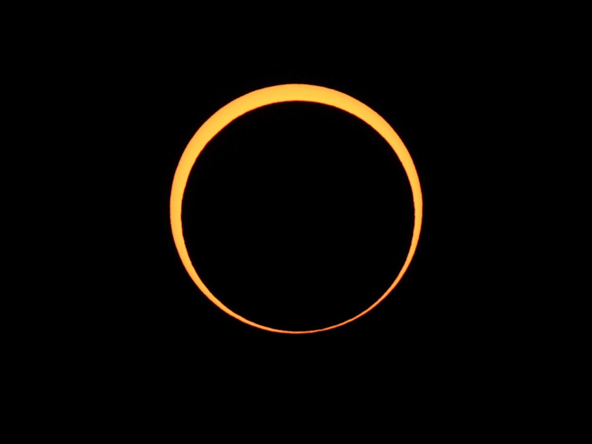 caption: The moon appears to cover the sun during an annular eclipse of the sun in May 2012, as seen from Chaco Culture National Historical Park in Nageezi, N.M.