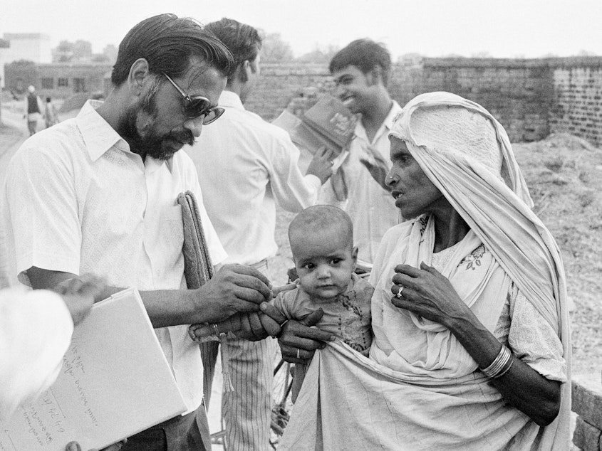 caption: The World Health Organization led this measles vaccination campaign in India in 1974 — reflecting its mission "to promote and protect the health of all peoples."