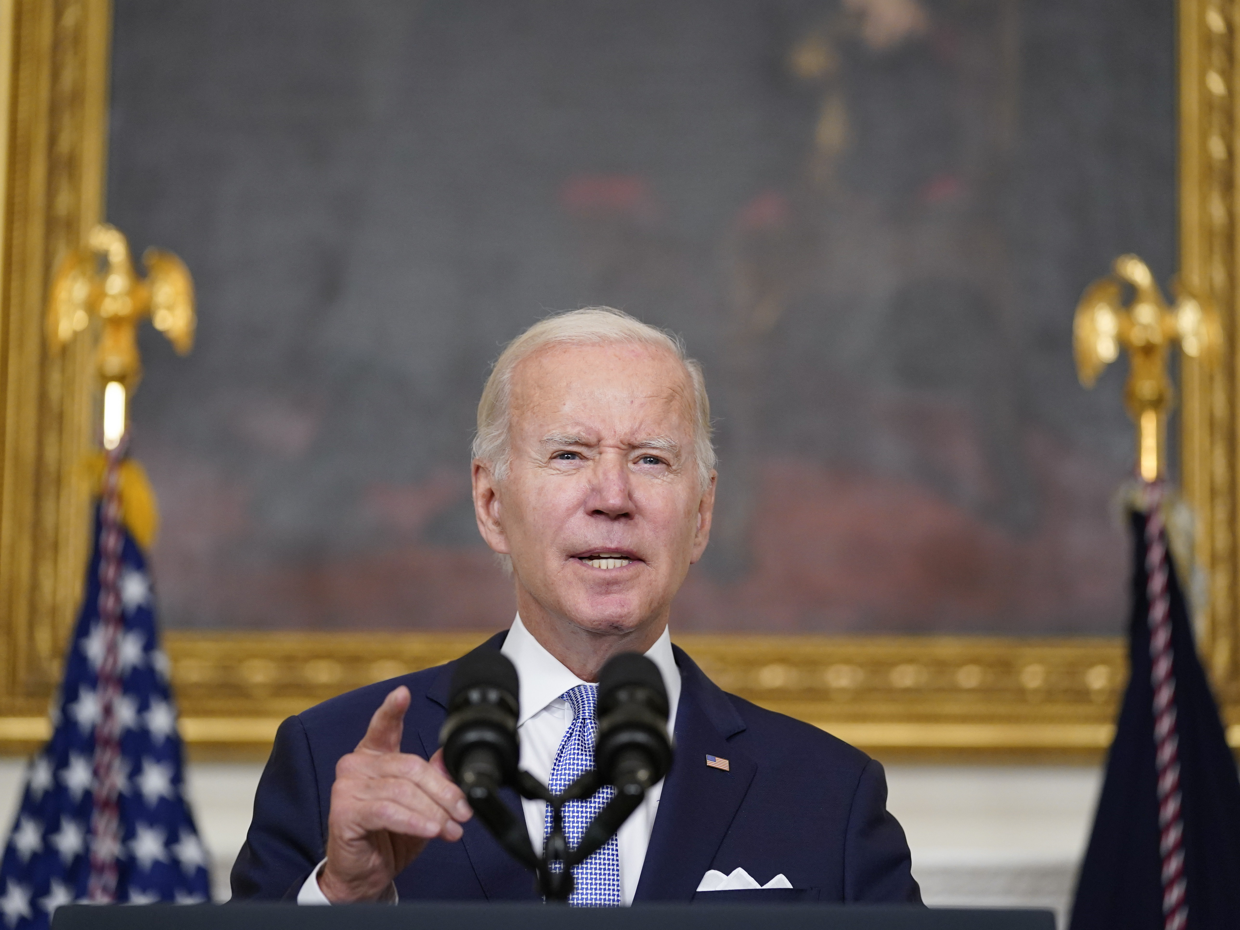 caption: In remarks from the White House Thursday, President Biden said the Inflation Reduction Act would reduce pressure on the economy from rising inflation.