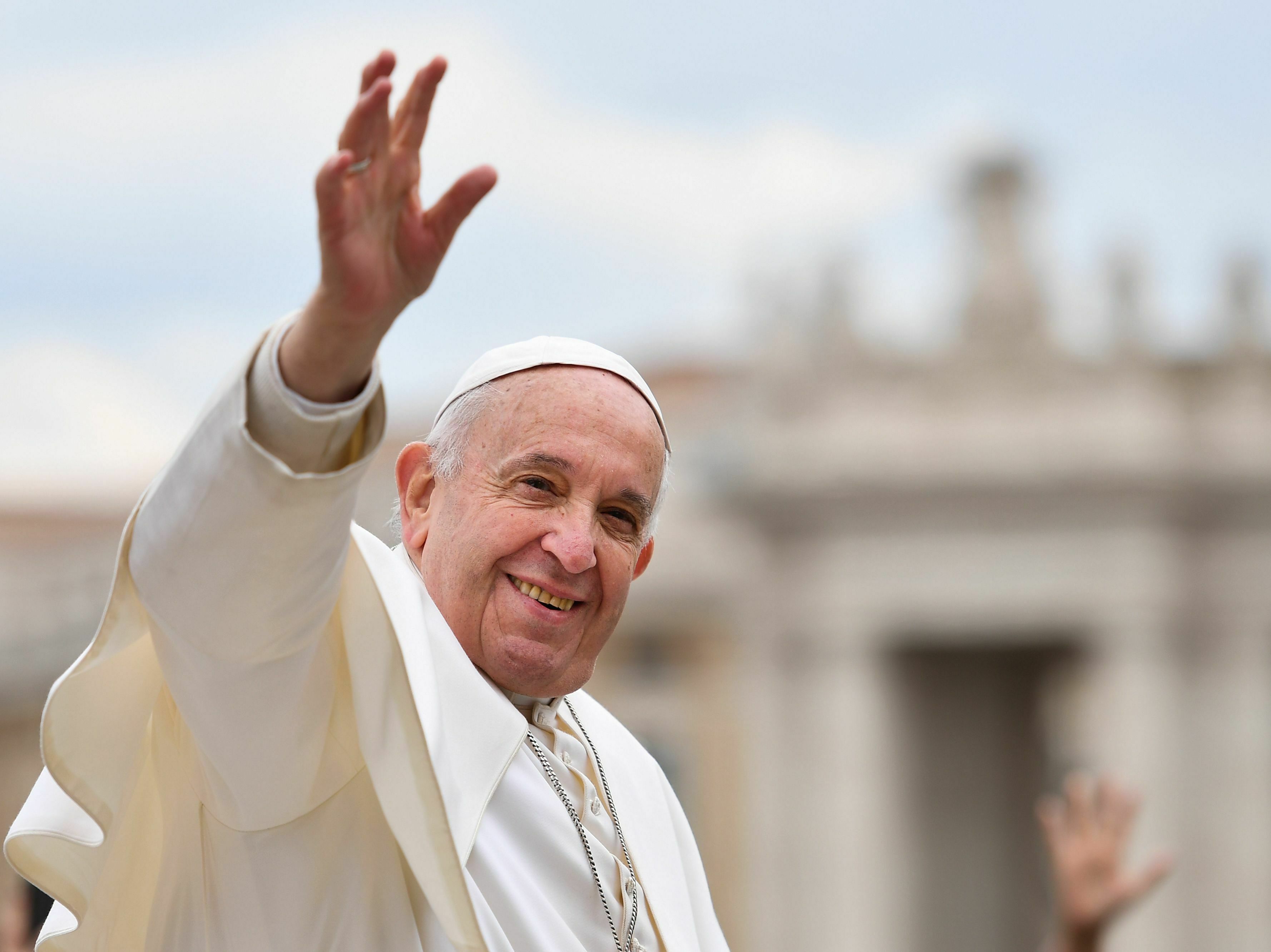 caption: Pope Francis waves to worshipers at the end of the weekly general audience on April 3, 2019 at St. Peter's square in the Vatican.