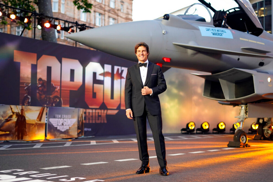 caption: Tom Cruise poses for the media during the 'Top Gun Maverick' UK premiere at a central London cinema, on Thursday, May 19, 2022.