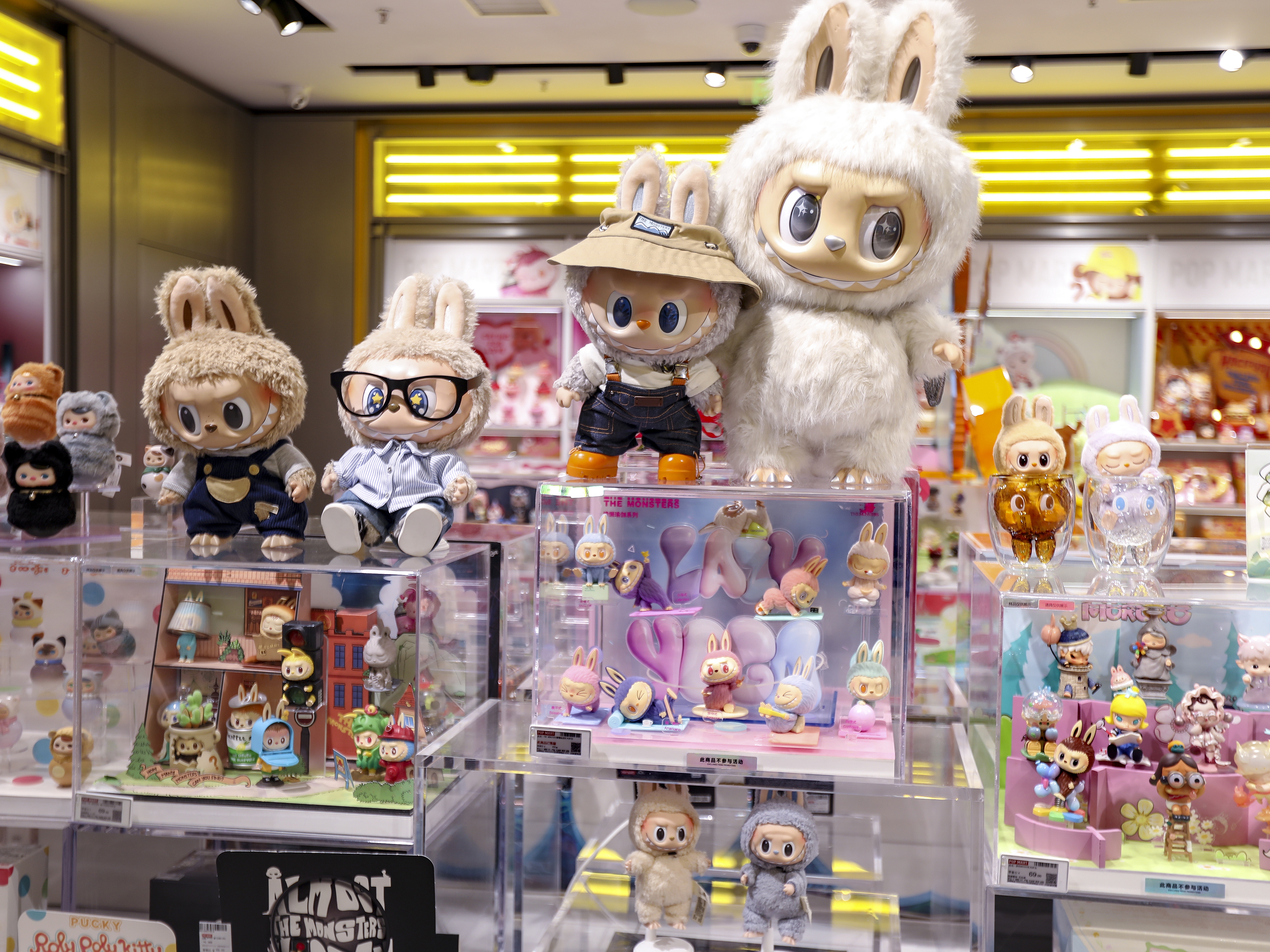 caption: Labubu figures and dolls are seen on display at a Pop Mart store on June 9 in Shanghai.