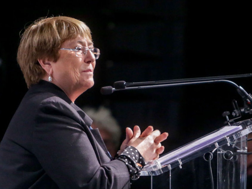 caption: The United Nations High Commissioner for Human Rights  Michelle Bachelet speaks at a climate event in Madrid in 2019. A recent report of hers warns of the threats that AI can pose to human rights.