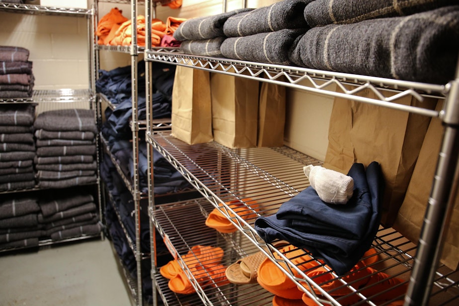 caption:  Socks, sandals, clothing and blankets line the shelves of a stock room at the Deschutes County Jail in Bend, Ore., Tuesday, March 12, 2019. In Oregon, jails must comply with a set of statewide standards that govern everything from riot control to a requirement that mattresses and blankets be fire-retardant. 