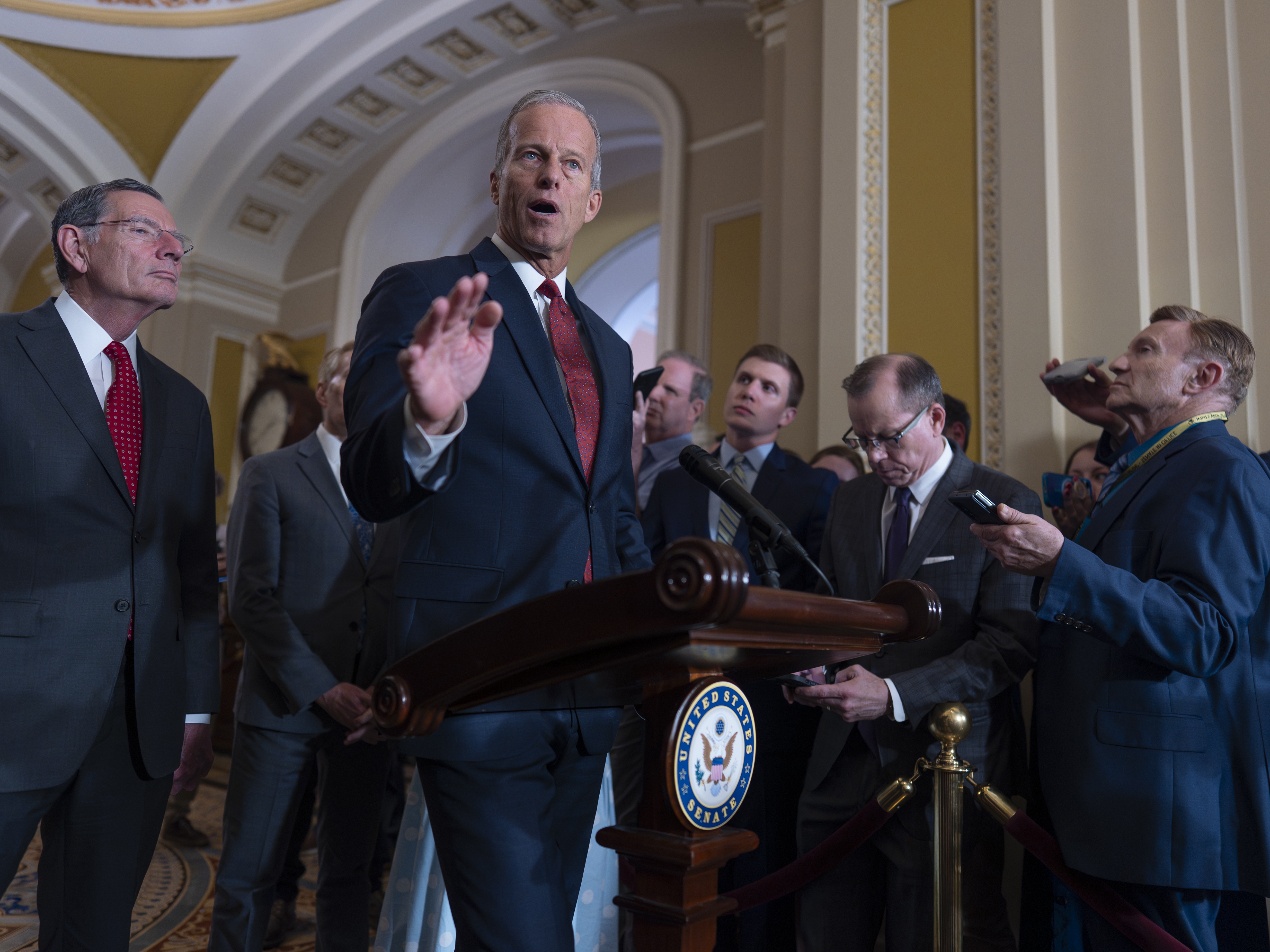 caption: Senate Majority Leader John Thune, R-S.D., center, speaks to reporters after GOP lawmakers met with Treasury Secretary Scott Bessent on Tuesday to discuss the sweeping tax and spending bill Republicans are hoping to have to President Trump by July 4.