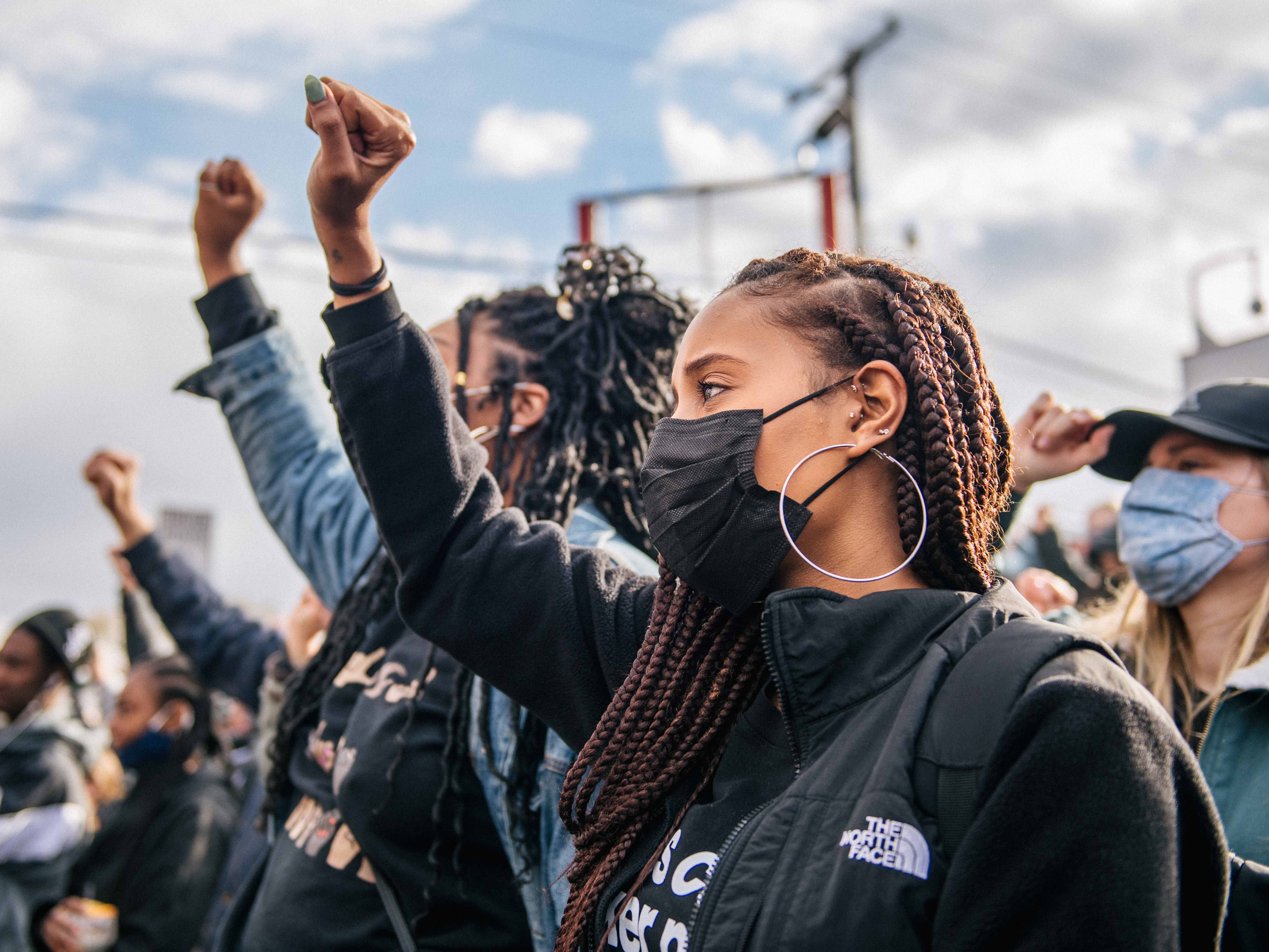 caption: People gather at George Floyd Square in Minneapolis. On Tuesday, police officer Derek Chauvin was found guilty of two murder charges and one manslaughter charge in the death of George Floyd.