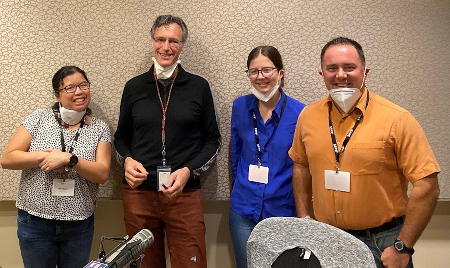 caption: Bill Radke discusses the week’s news with Seattle Times Isabella Breda, Seattle Channel’s Brian Callanan and Crosscut’s Mai Hoang.