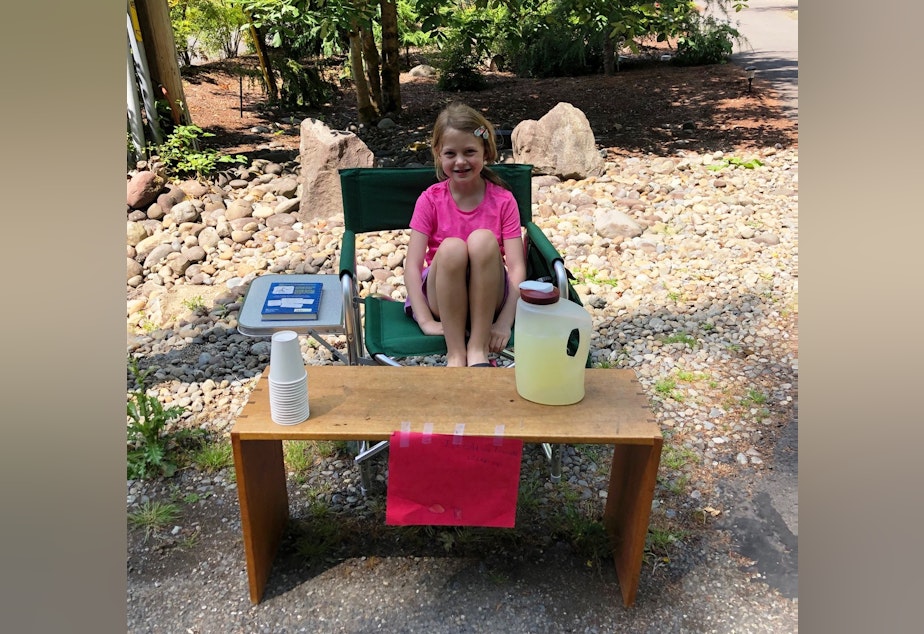 caption: Reporter Austin Jenkins' daughter Sophie selling lemonade last summer. Bills in the Washington Legislature would prohibit local governments from regulating kid-run lemonade stands.