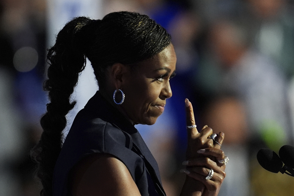 caption: Former first lady Michelle Obama speaks during the Democratic National Convention Tuesday, Aug. 20, 2024, in Chicago. 