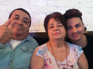 caption: Miguel Lerma, right, with his grandparents who raised him, Jose and Virginia Aldaco.