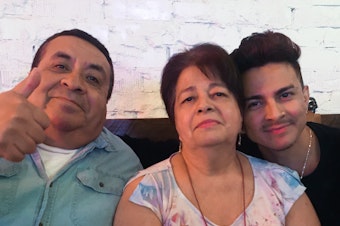 caption: Miguel Lerma, right, with his grandparents who raised him, Jose and Virginia Aldaco.