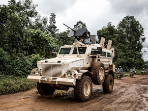 caption: A U.N. military truck patrols on the road linking Mangina to Beni, the current epicenter of the Ebola outbreak in Democratic Republic of the Congo.