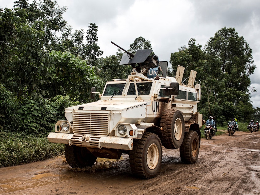 caption: A U.N. military truck patrols on the road linking Mangina to Beni, the current epicenter of the Ebola outbreak in Democratic Republic of the Congo.
