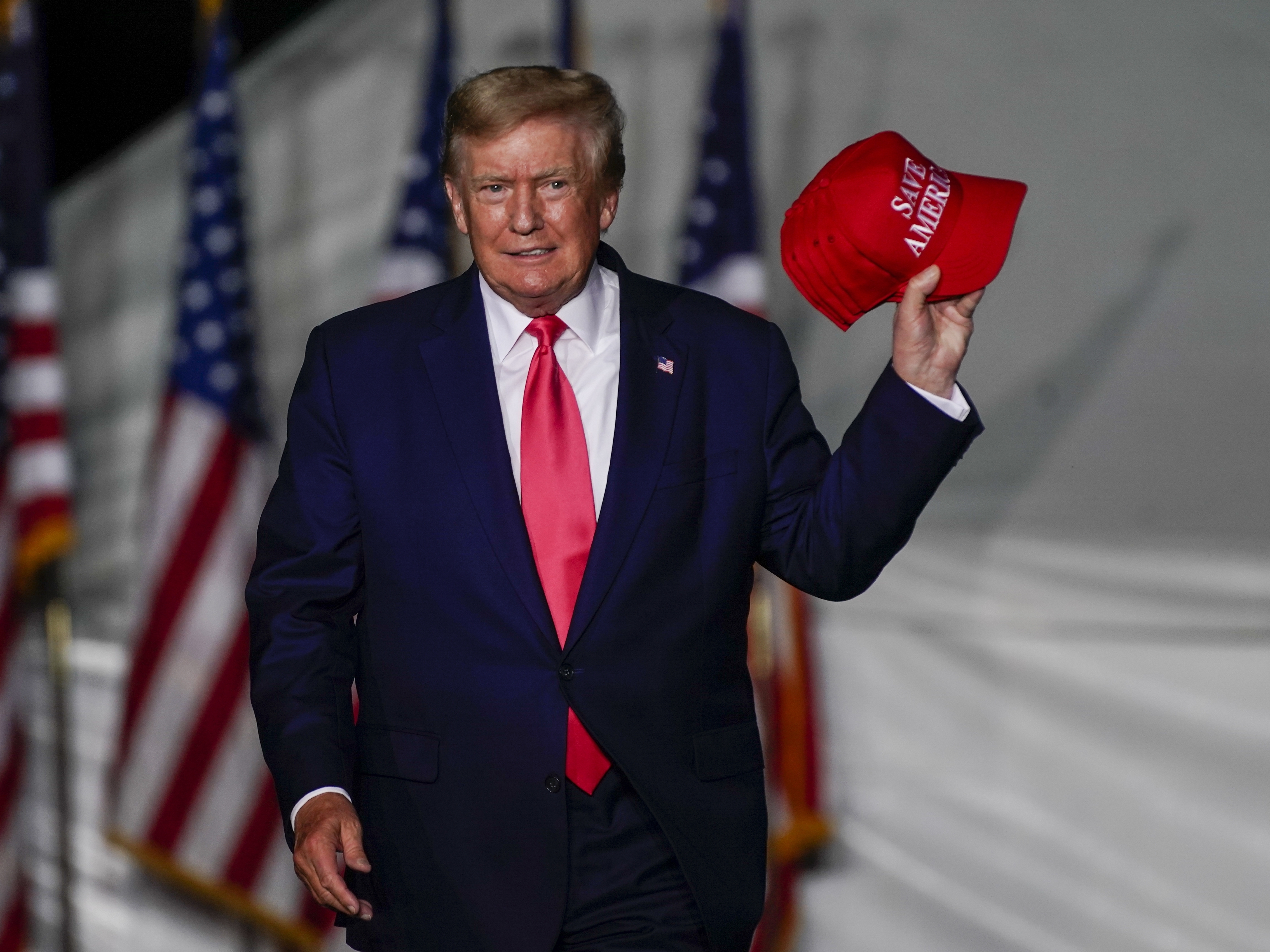 caption: Former President Trump arrives at a rally Friday, Aug. 5, in Wisconsin. Trump has been the subject of several ongoing investigations into his businesses and actions while in the White House.