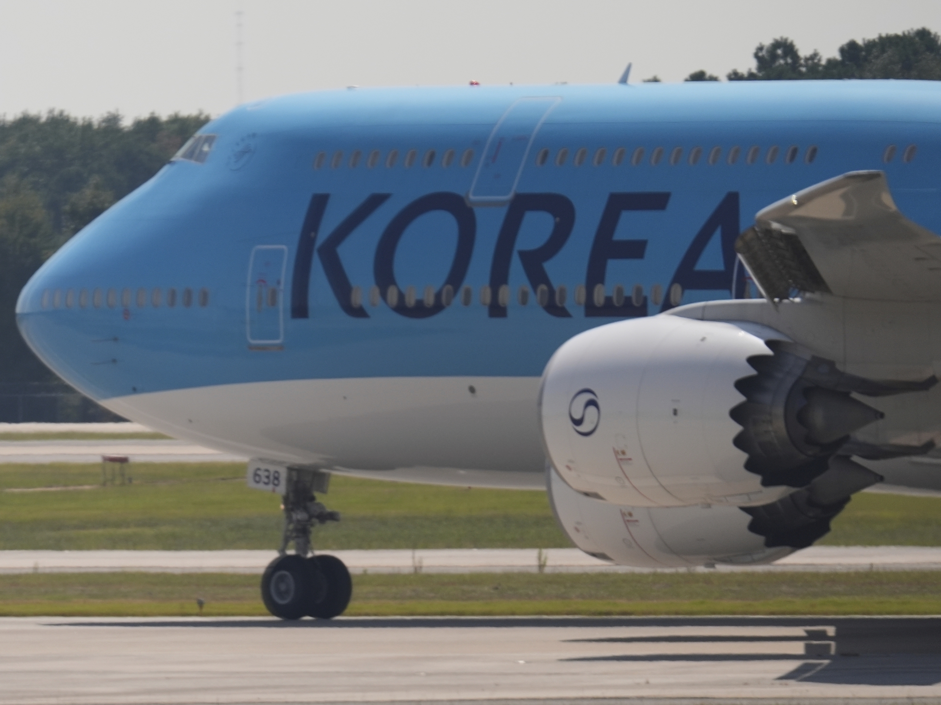 caption: A Korean Air charter plane carrying Korean workers detained in immigration raid at Georgia factory leaves Hartsfield-Jackson International Airport in Atlanta bound for South Korea on Thursday.
