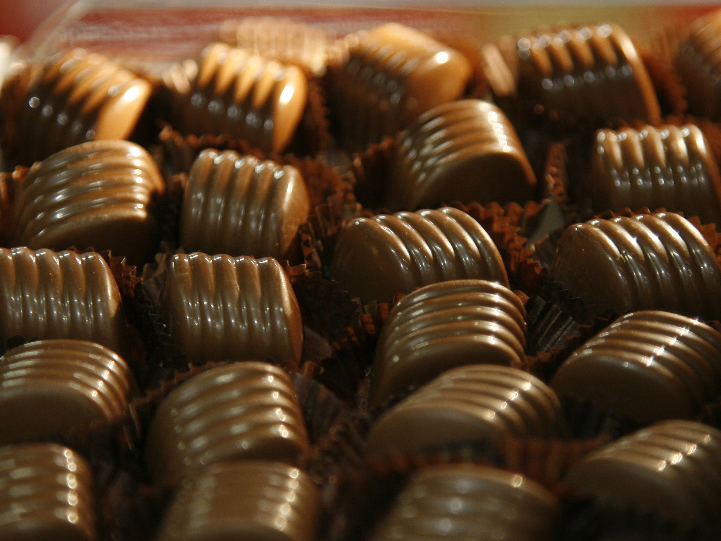 caption: Chocolate-makers and sellers have been raising prices to keep up with the skyrocketing costs of cocoa.