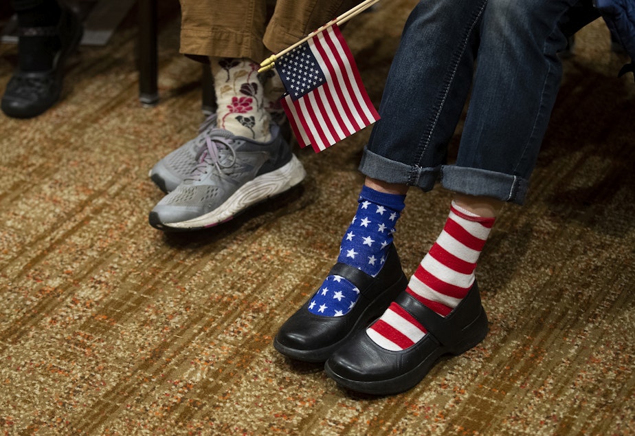 caption: Supporters wait for election results to appear on screen during a Republican Party election night gathering on Tuesday, November 8, 2022, at the Hyatt in Bellevue. 
