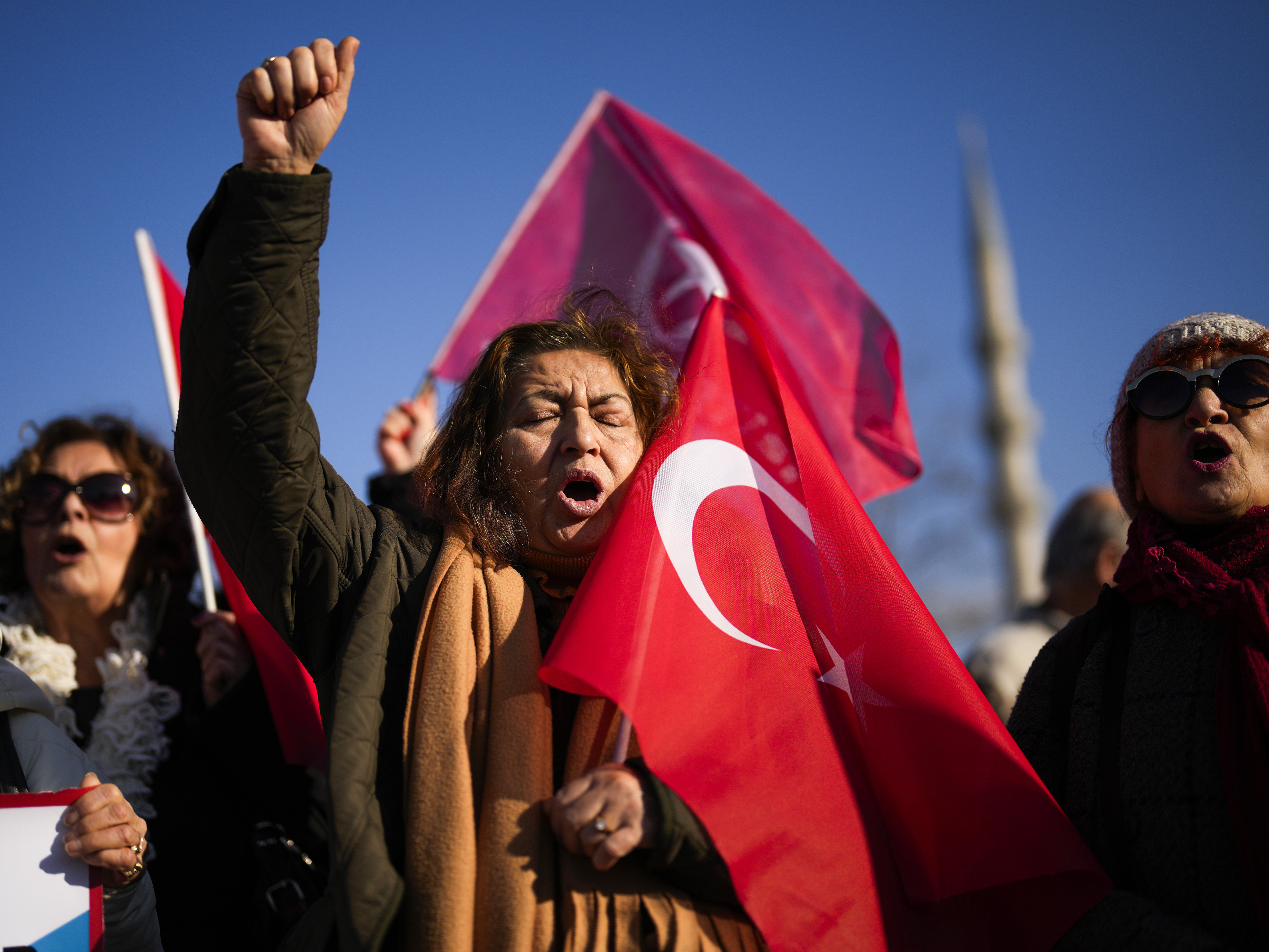 caption: People shout slogans during a protest against Sweden's NATO membership called by Turkish Vatan, or Patriotic Party, in Istanbul on Tuesday.