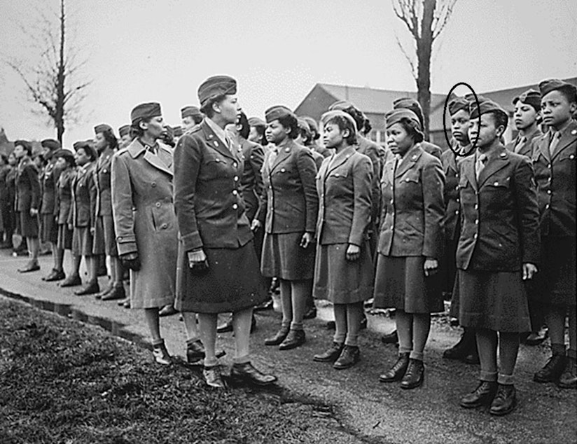 caption: Indiana Hunt Martin is shown (circled) in England in February 1945 as the 6888th Central Postal Directory Battalion is reviewed by their commander, Major Charity Adams.