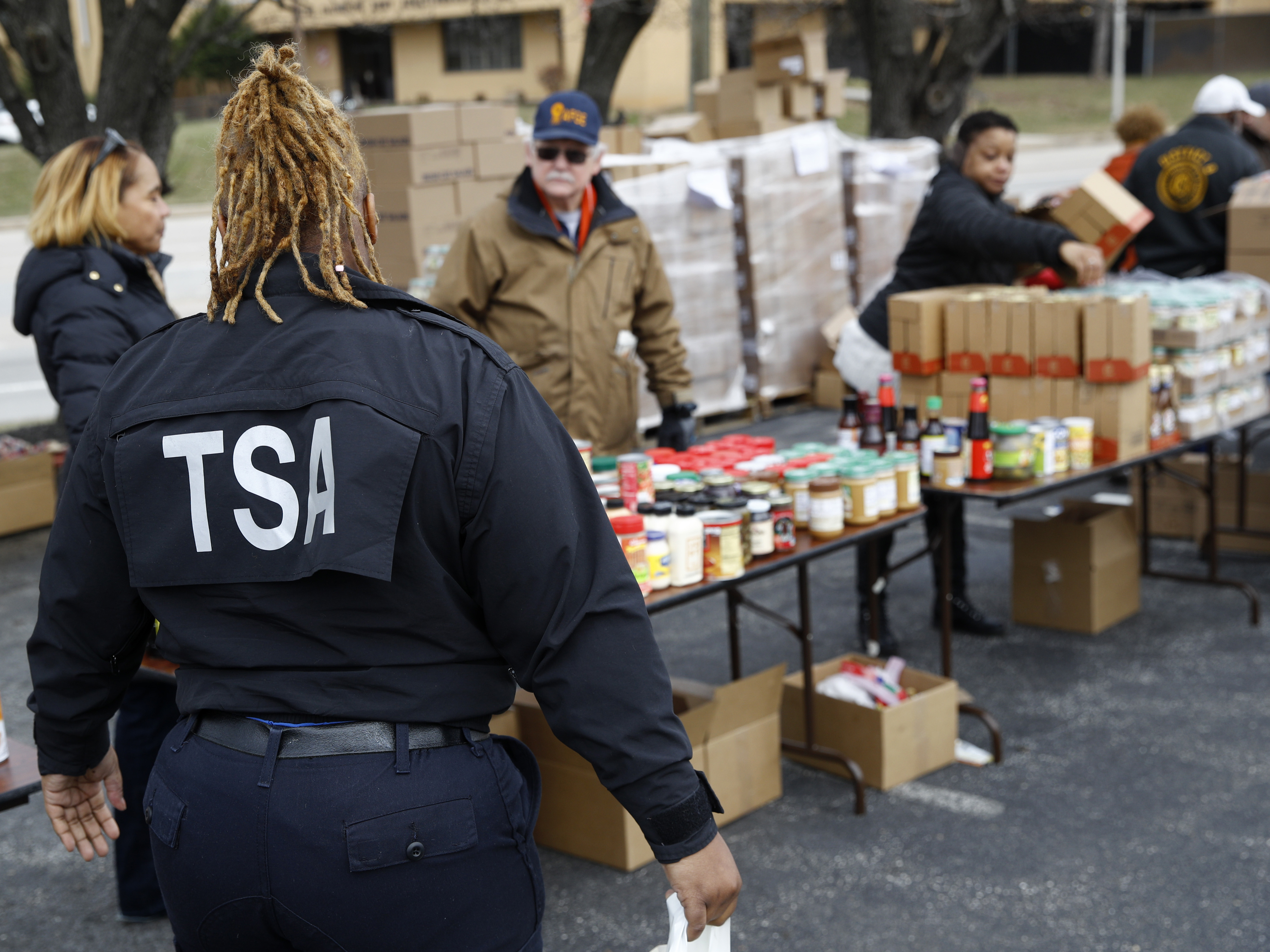 caption: A TSA employee visits a food pantry for government workers affected by the federal shutdown, in Baltimore.