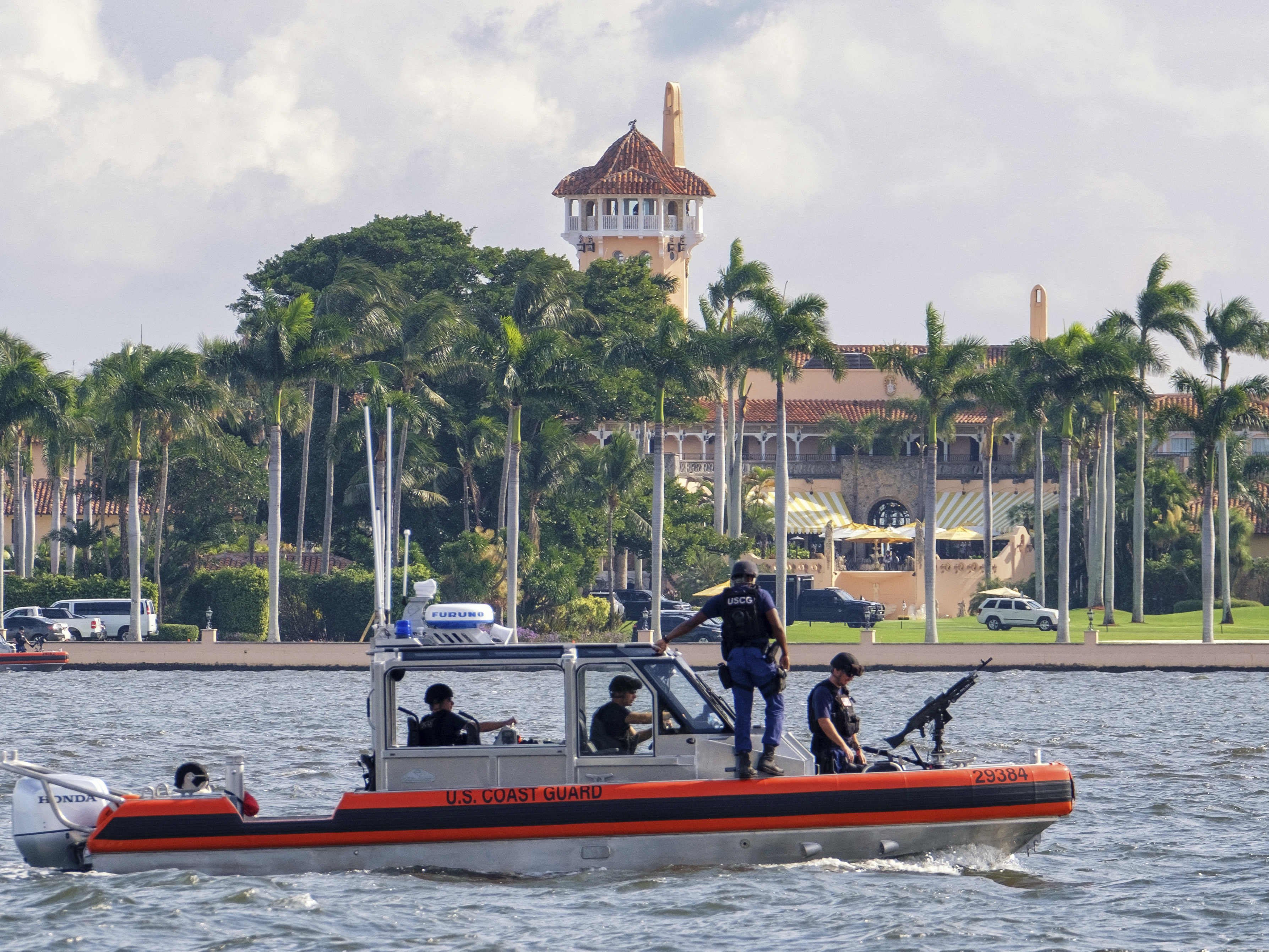 caption: A Coast Guard patrol boat in the waters off Mar-A-Lago.