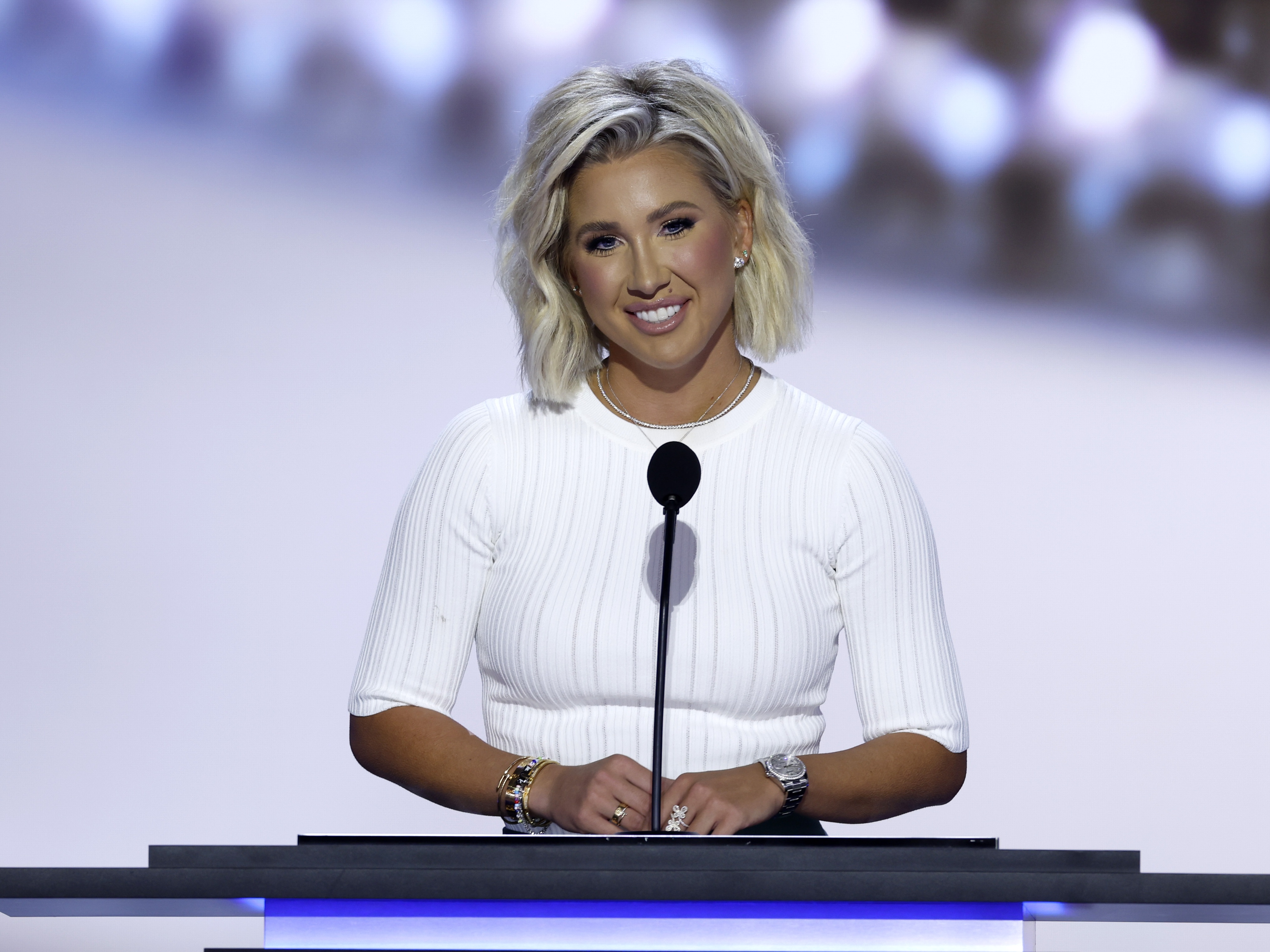 caption: Reality TV star Savannah Chrisley speaks on stage on the second day of the Republican National Convention on Tuesday in Milwaukee, Wis.