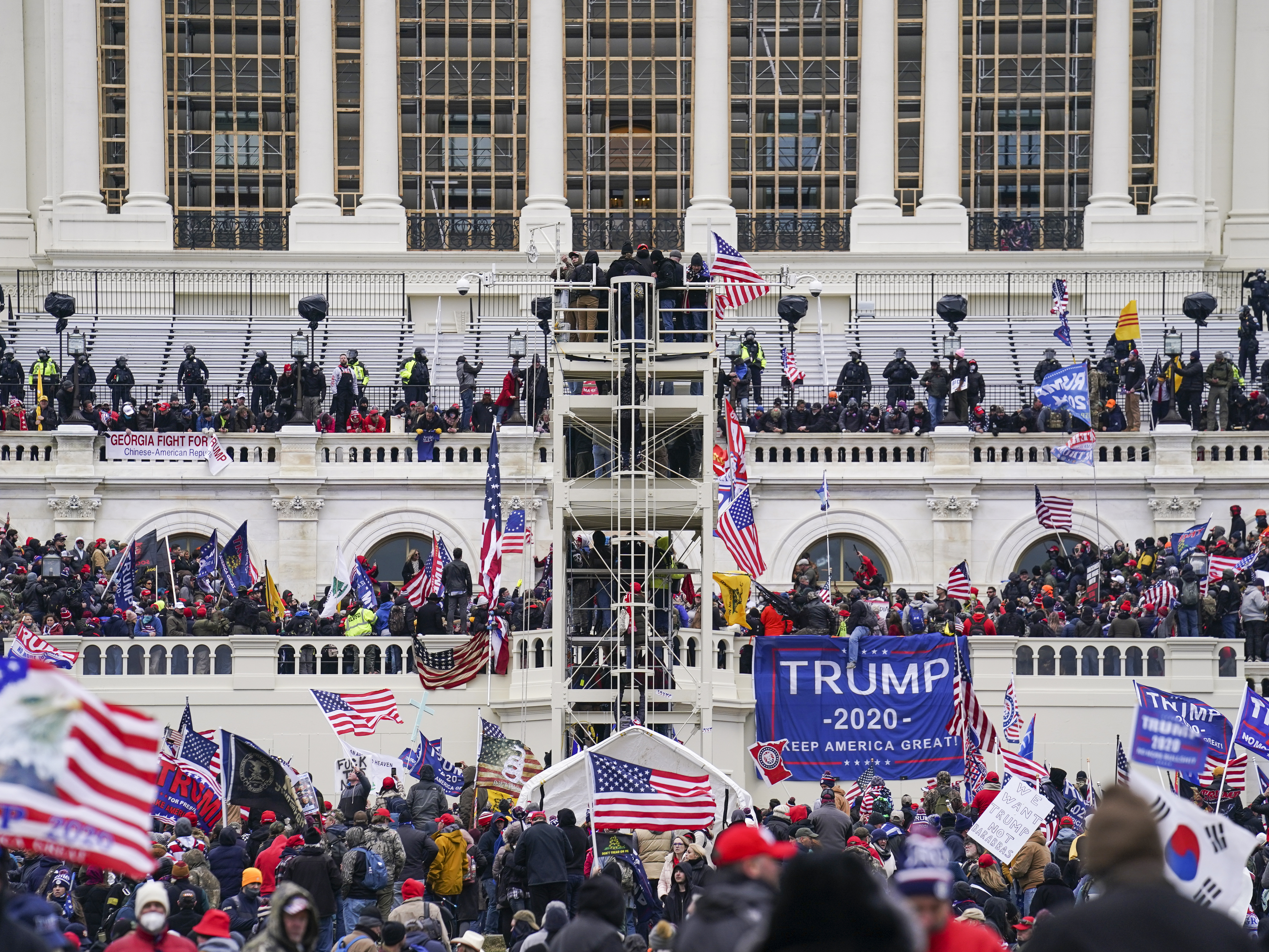 caption: Insurrectionists loyal to former President Donald Trump breach the Capitol in Washington on Jan. 6. Prosecutors secured the first guilty plea in the major case brought against members of the Oath Keepers extremist group in the attack on Wednesday.