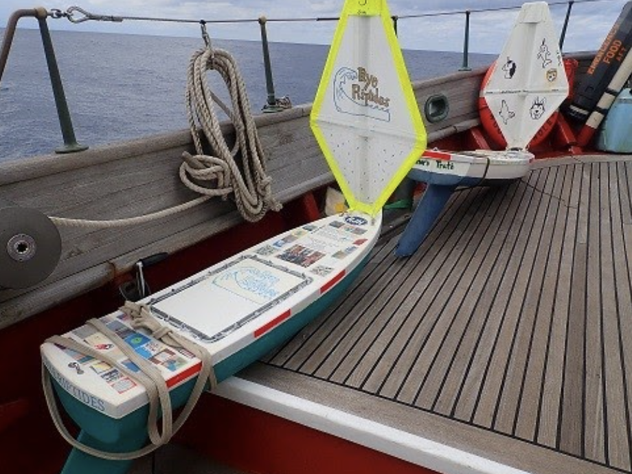 caption: The <em>Rye Riptides</em> pictured on board the Corwith Cramer before launching in October 2020. Nearly 18 months later, the mini boat was retrieved from an uninhabited Norwegian island with its messages and gifts intact.