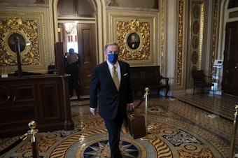caption: Michael van der Veen, lawyer for former President Donald Trump, walks to the Senate floor through the Senate Reception room on the fourth day of the Senate Impeachment trial for former President Donald Trump.