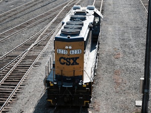 caption: Under the leadership of its new CEO Joe Hinrichs, CSX struck a deal with two rail unions offering paid sick leave to about 5,000 workers.