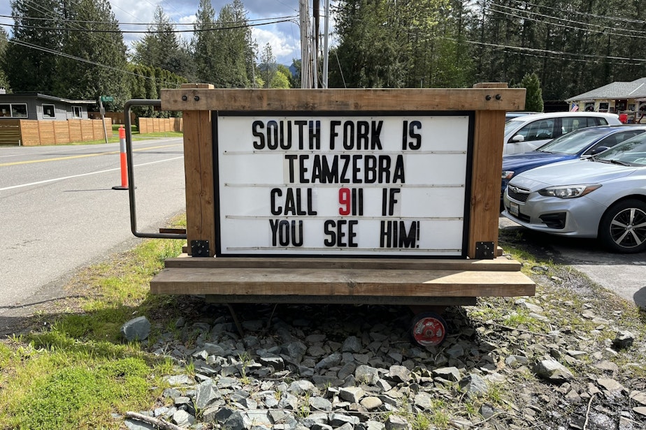 caption: A sign outside the South Fork restaurant in North Bend. 

UPDATE: Authorities have now revealed that contrary to the owner's original statement, the zebra is a mare, or female zebra, not a stallion.