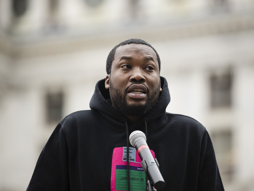 caption: Recording artist Meek Mill is seen on April 2 at a Philadelphia gathering to push for changes to Pennsylvania's probation system.