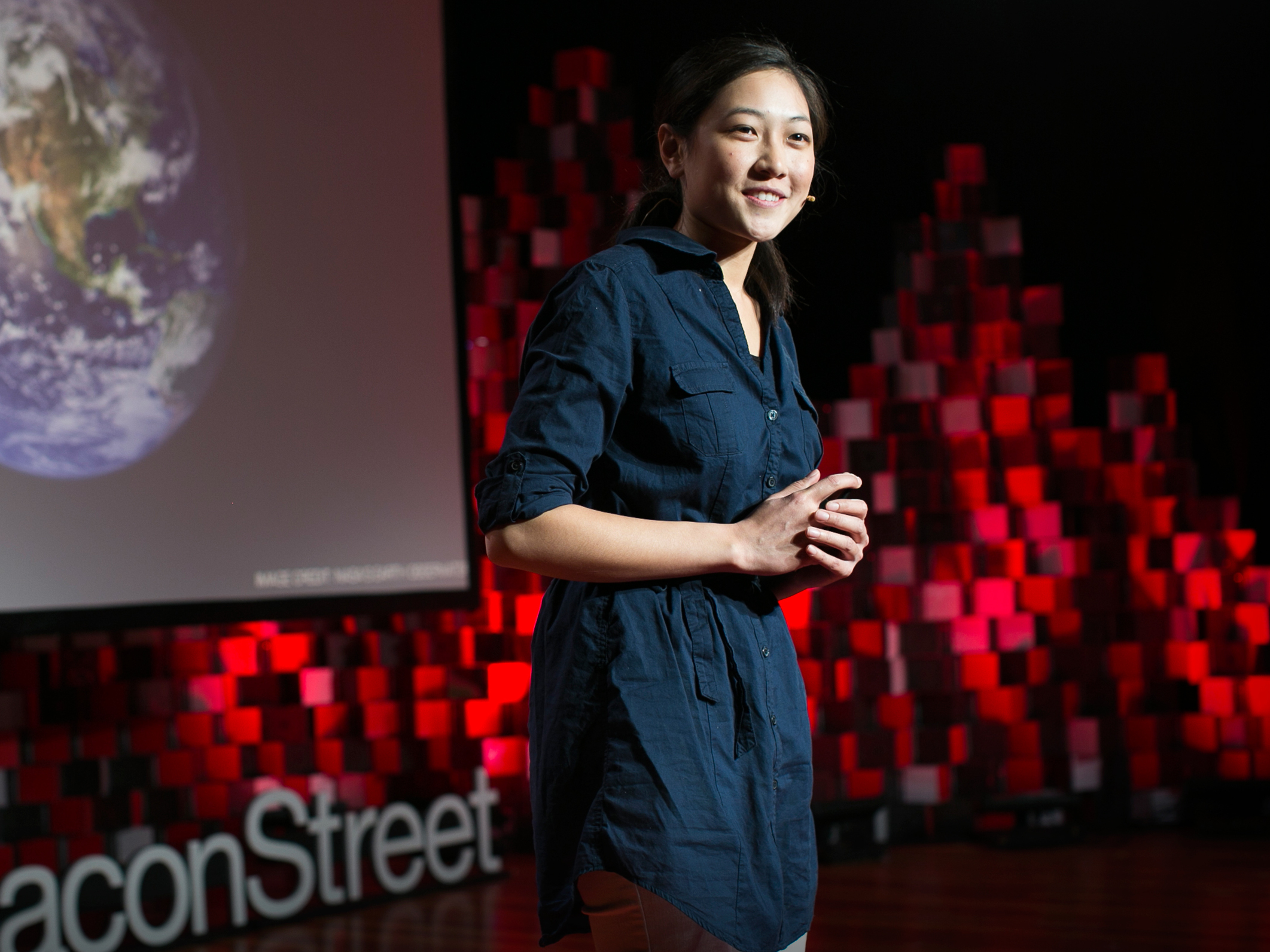 caption: Lisa Nip on the TED stage.