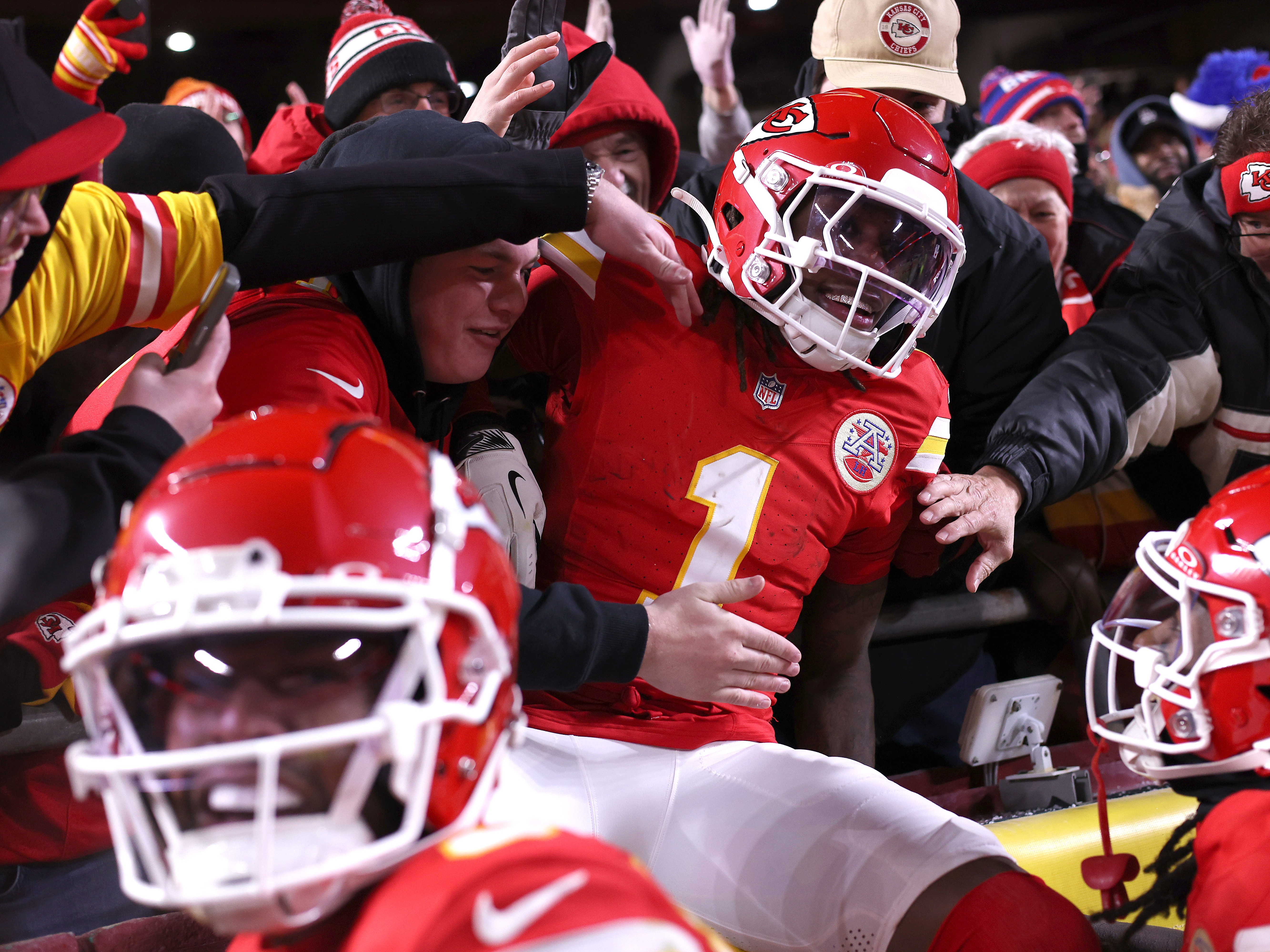 caption: Xavier Worthy #1 of the Kansas City Chiefs jumps into the stands after scoring a touchdown during the second quarter against the Buffalo Bills in the AFC Championship Game at GEHA Field at Arrowhead Stadium on Jan. 26 in Kansas City, Missouri.