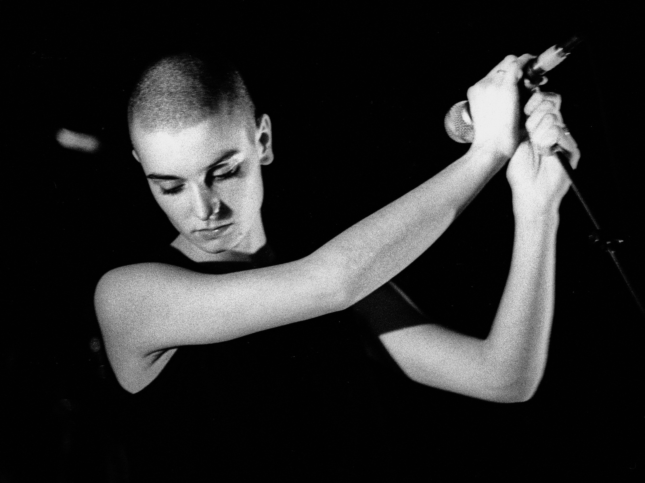 caption: Going back to her earliest days as a performer, Sinéad O'Connor has always rode an uneasy tension between suffering and liberation.