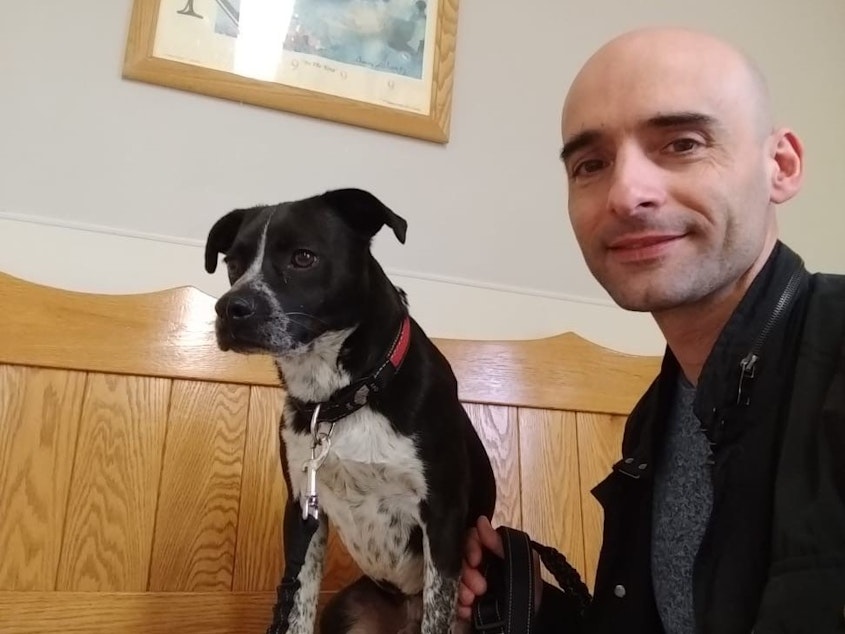 caption: Josep Navas Masip, seen with his dog Ruquet, purchased a second home in Philadelphia and was renovating it for use as an Airbnb when the coronavirus crisis hit. Now his plans are cancelled and he's unsure what to do for income.