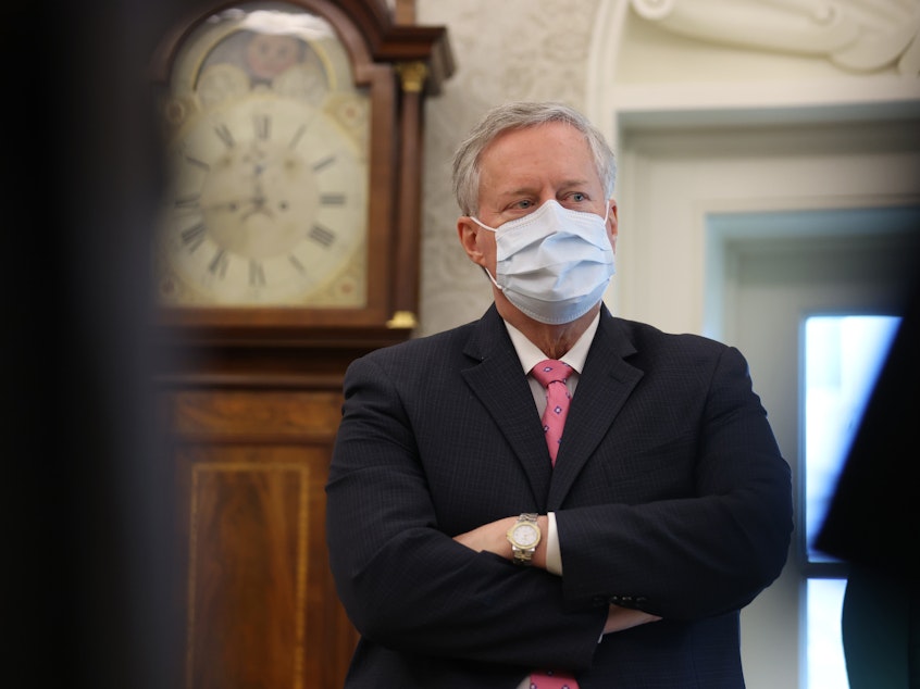 caption: Former White House Chief of Staff Mark Meadows listens as former President Donald Trump speaks about a Sudan-Israel peace agreement in the Oval Office on October 23, 2020.