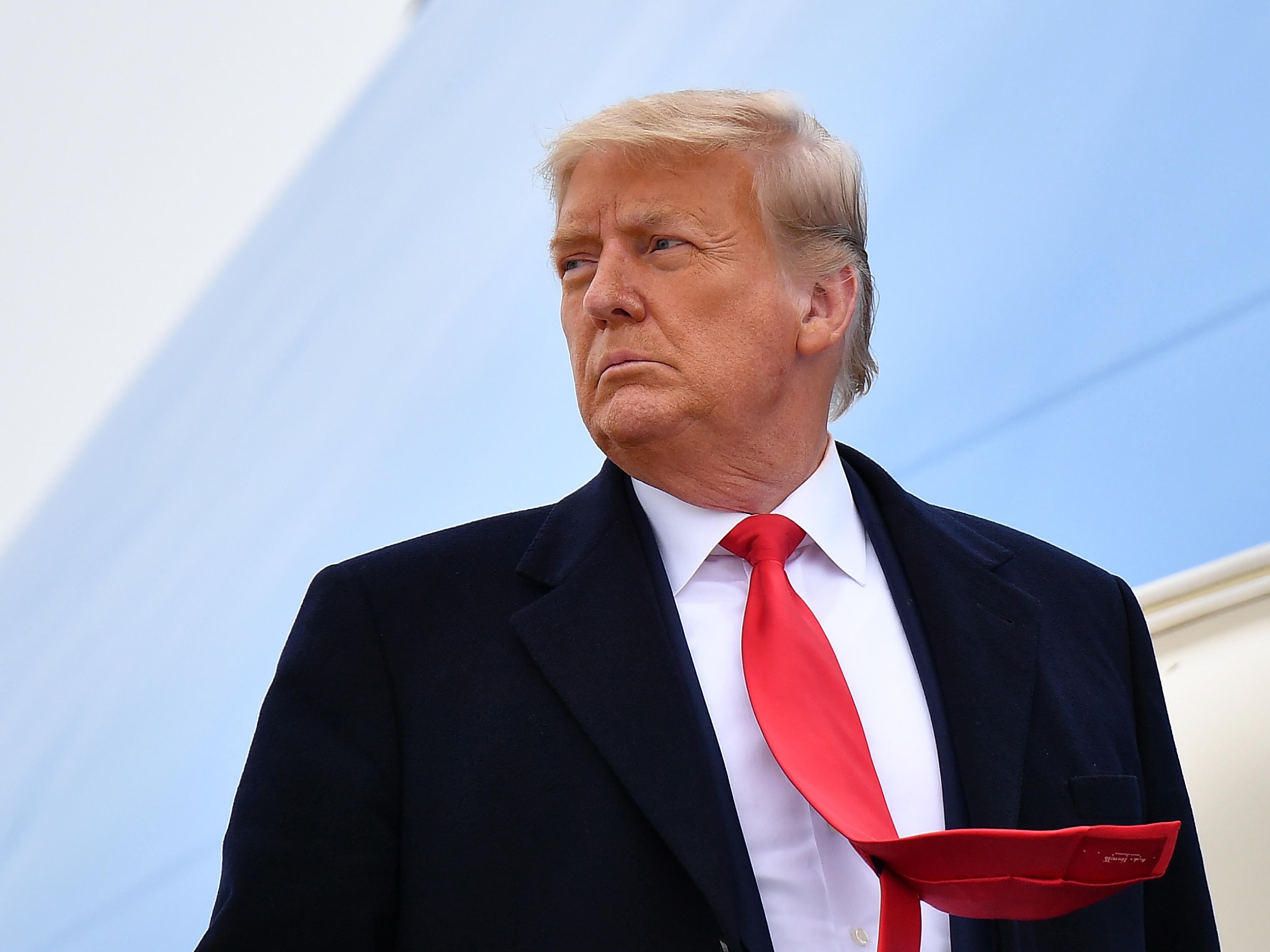 caption: Then-President Donald Trump boards Air Force One before departing Harlingen, Texas on Jan. 12, 2021.