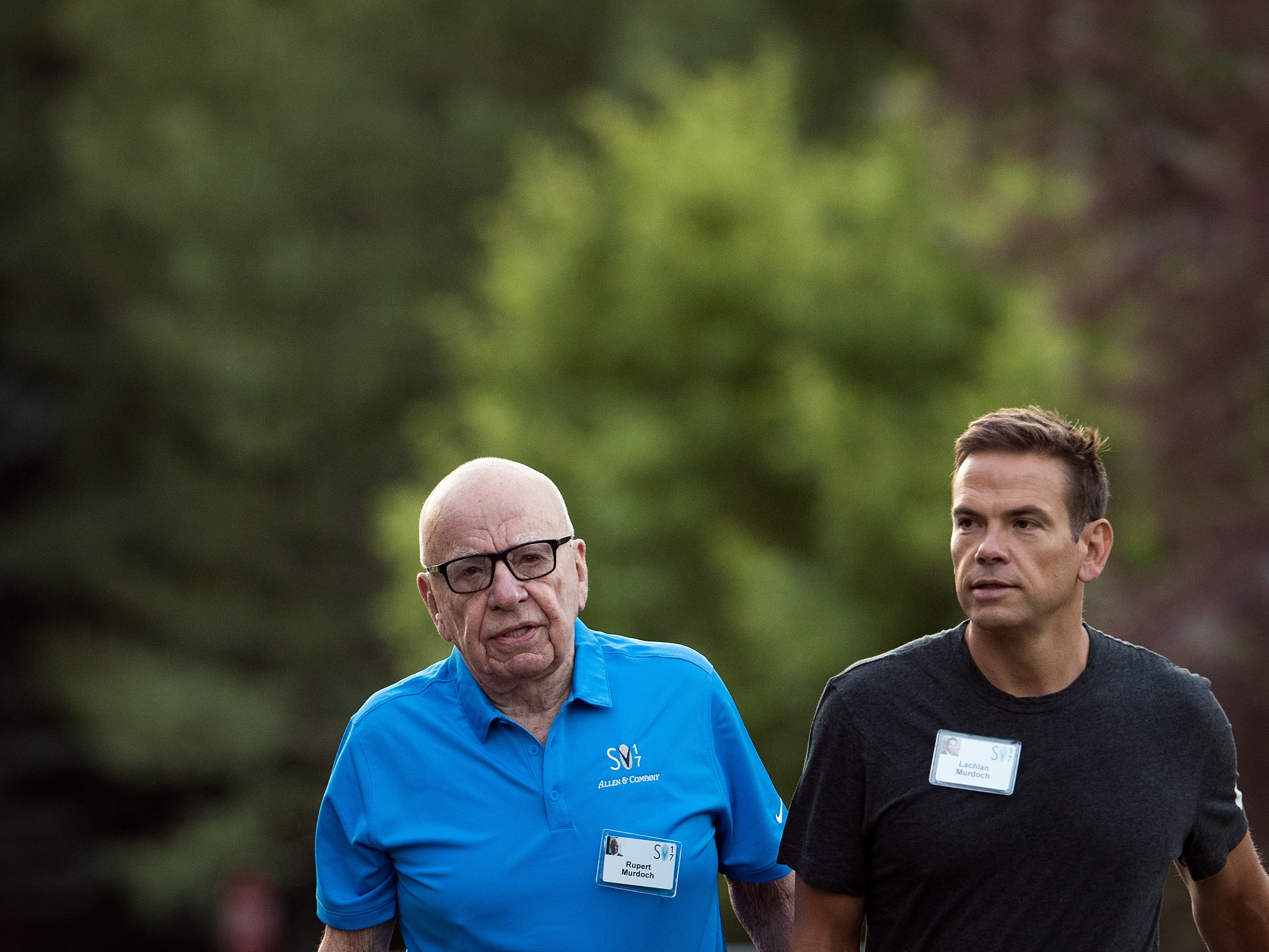 caption: Rupert Murdoch is ensuring the handoff of power to his oldest son Lachlan, ending a saga over the control of News Corp. and Fox News. Father and son are seen here in July 2017, as they attended the Allen &amp; Company Sun Valley Conference in Sun Valley, Idaho.