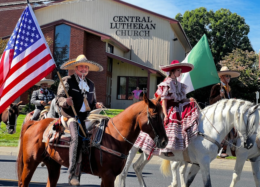 caption: Mexican-American “charros,” a group of skilled horse riders in costume, were a highlight of the 2022 Sunfair Parade in Yakima. 